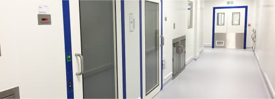 white hallway with blue trimmed glass doors