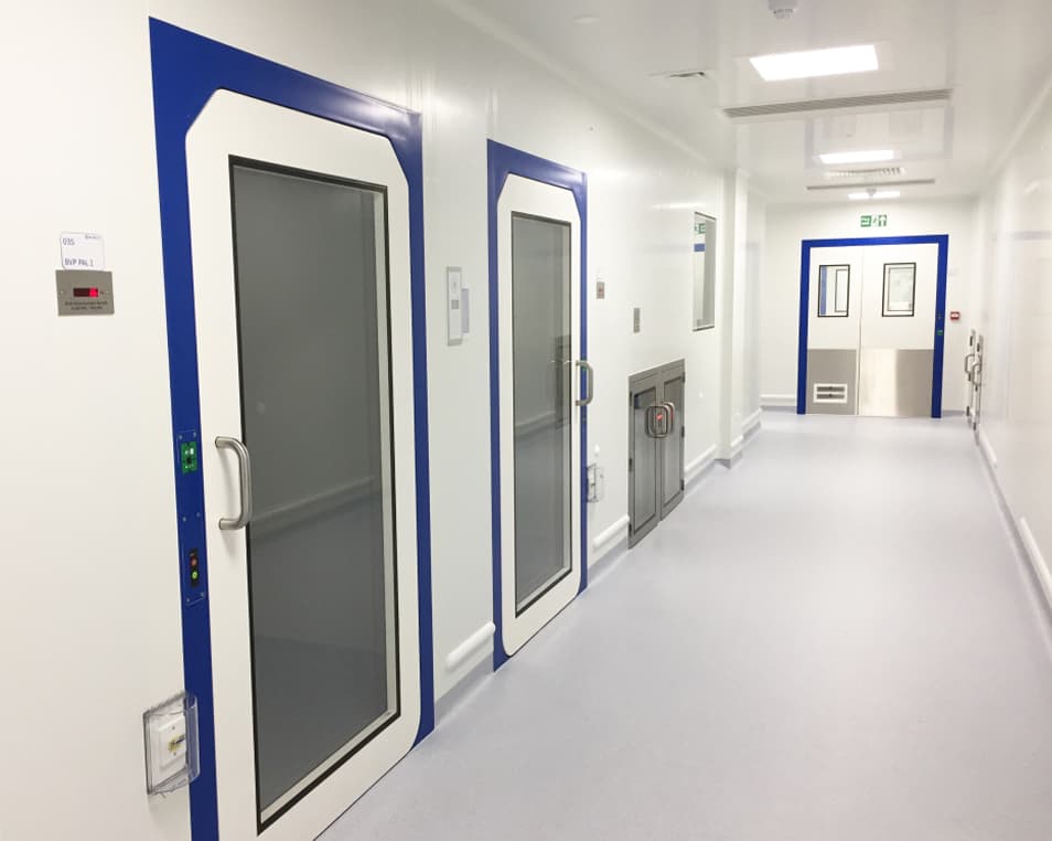 White hallway with grey doors