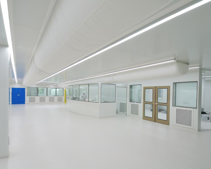 large white room with a glass panelled observation area