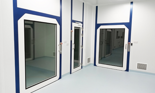 three blue trimmed glass doors in a white room