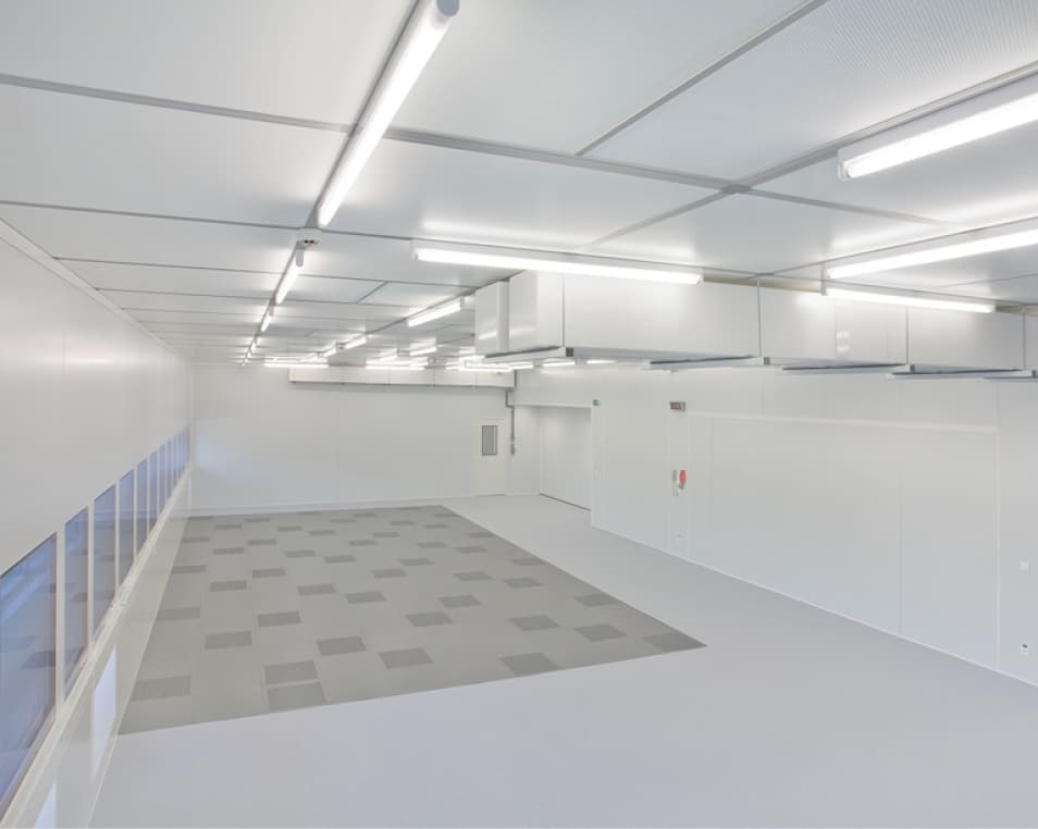 large white room with white ducting on the ceiling